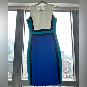 Calvin Klein size 4 dress. The colors are white, black, teal, and navy.